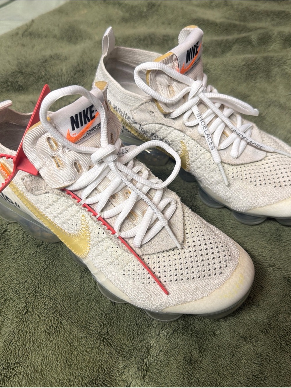 Nike Kids Cream Sneakers with Yellow Swoosh and Red Accents
